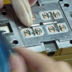 Vibration Motor Factory Production Line - COUNTER WEIGHTS BEING INSERTED IN COIL ASSEMBLY