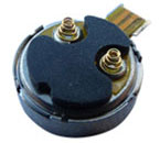 Photo of Vybronics coin vibrator motor with spring contacts